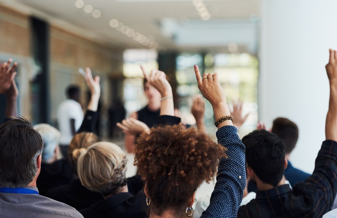 Group of business people asking questions